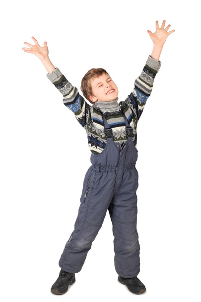 malý chlapec v jednodílný oblek úsměv a položil ruku nahoru izolované - Fotografie, Obrázek