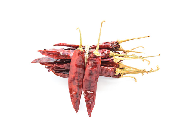 Dried chili peppers on white background - Foto, afbeelding