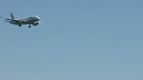 Plane flying in blue sky, aircraft landing at airport, passenger transportation - Filmagem, Vídeo