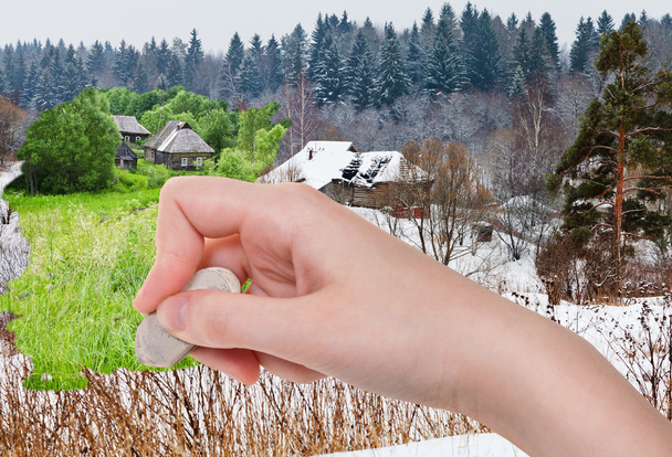 hand deletes winter village by rubber eraser - Zdjęcie, obraz
