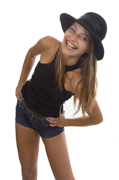 Young woman in a black hat on a white background - Fotoğraf, Görsel