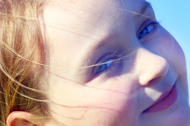 portrait of little squinting girl with nice face - Φωτογραφία, εικόνα