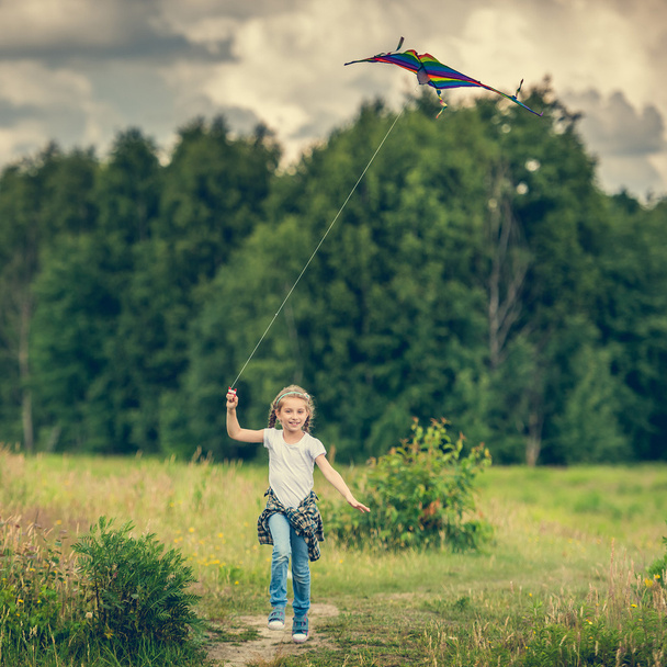 Little cute girl flying  kite - Photo, image