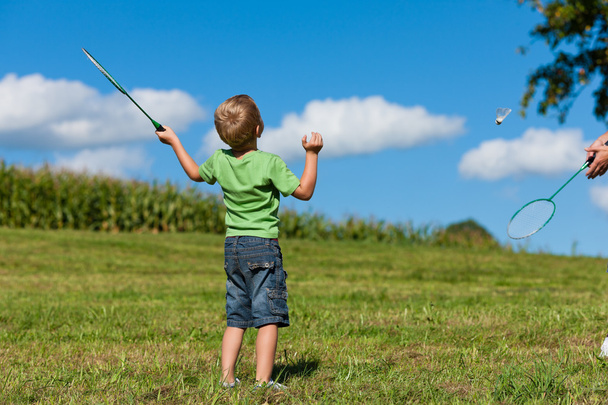 Family - little boy playing badminton outdoors - 写真・画像