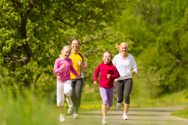 Family jogging for sport outdoors - Photo, Image