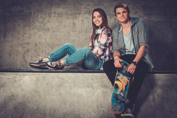 Young couple with skateboard - Фото, зображення