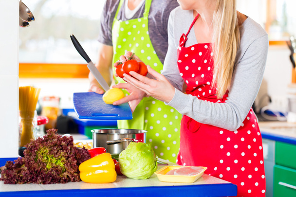 Couple cooking in domestic kitchen healthy food - Photo, Image