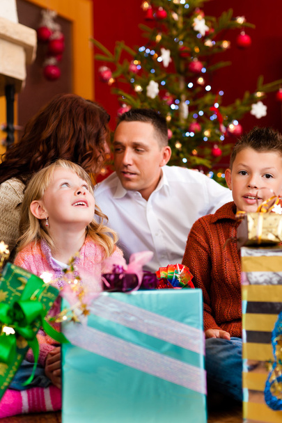 Christmas - family with gifts on Xmas Eve - 写真・画像