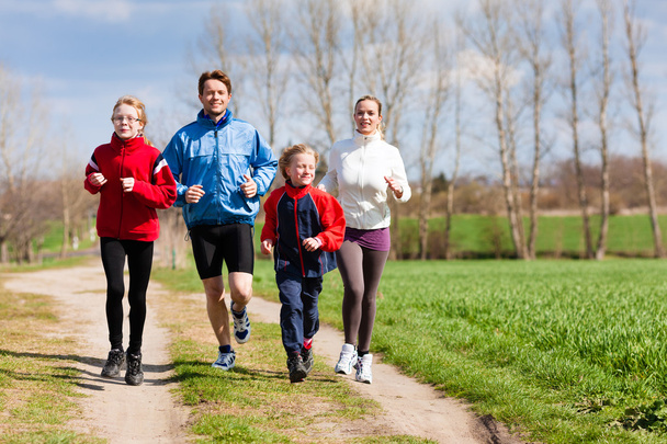 Family is running outdoors - Foto, Imagem