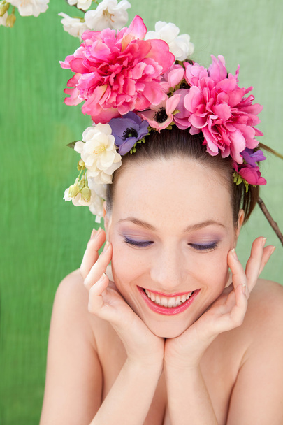 girl wearing a spring flowers hair dress - Photo, Image