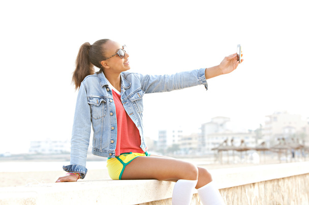 teenager girl take a selfie portrait of herself - 写真・画像