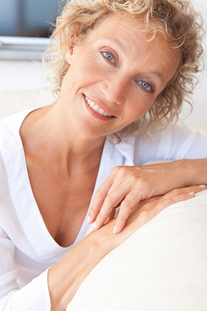 Portrait of mature woman relaxing at home - Photo, Image
