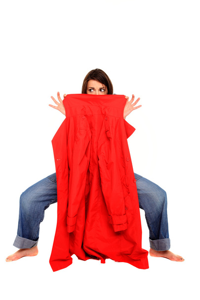 Girl with jean holding a red coat - Foto, imagen