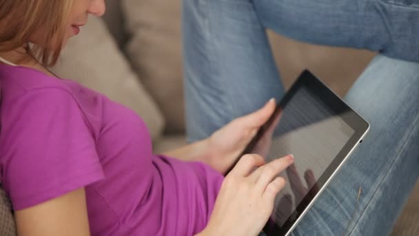 Teenager sitting  with touchpad - Кадри, відео