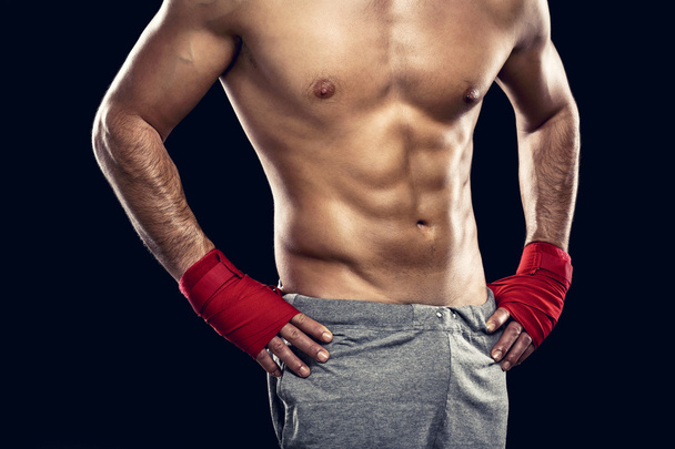 shirtless muscular athlete in boxing bandages - Foto, Imagen