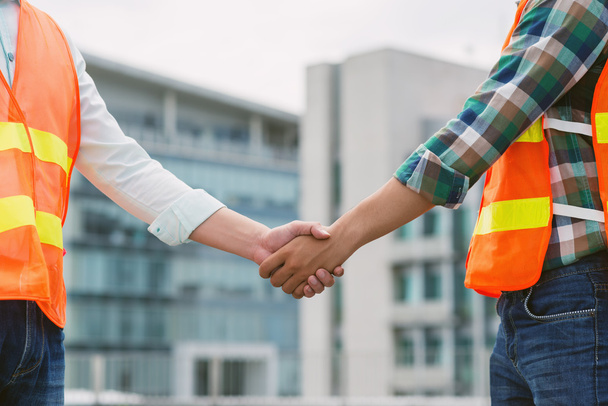 contractor and worker shaking hands - Photo, Image