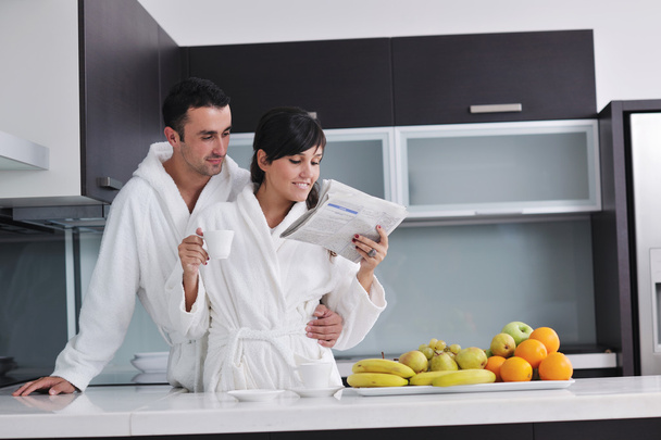 Young couple have fun in modern kitchen - Φωτογραφία, εικόνα