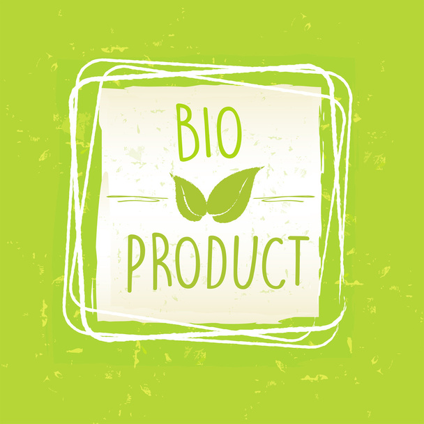 Bioprodukt mit Blattzeichen im Rahmen über grünem altem Papierrücken - Foto, Bild