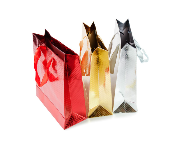 Bunch colorful paper bags for gifts isolated on white - Photo, Image