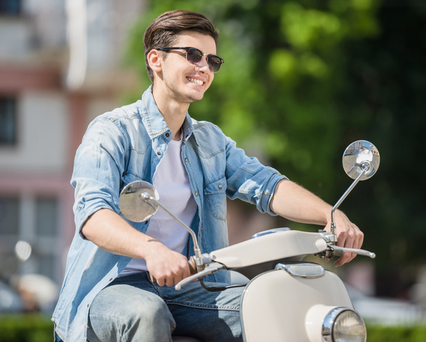 Young man on scooter - Photo, Image