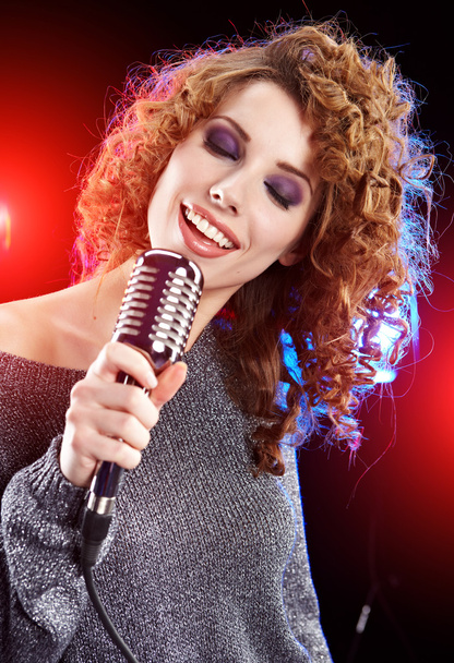 Rock star.Sexy Girl singing in retro mic - Zdjęcie, obraz