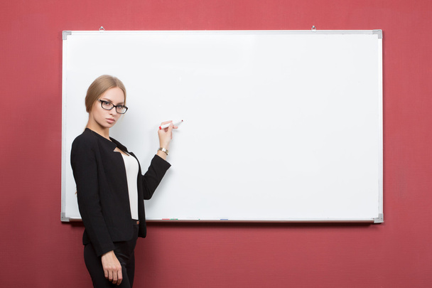 business woman pointing at the whiteboard - Фото, зображення