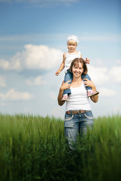 mother with daughter in the field - Photo, image