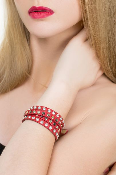 hands close-up of a young girl with leather bracelet - Foto, Imagem
