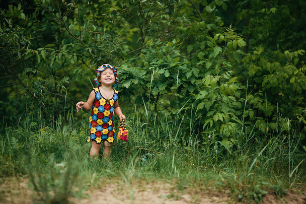 little girl with bright colorful dress - Foto, Imagen