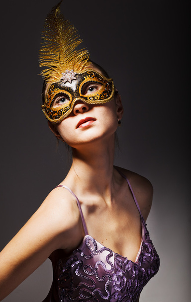 Beautiful young woman wearing black carnival mask - Photo, Image