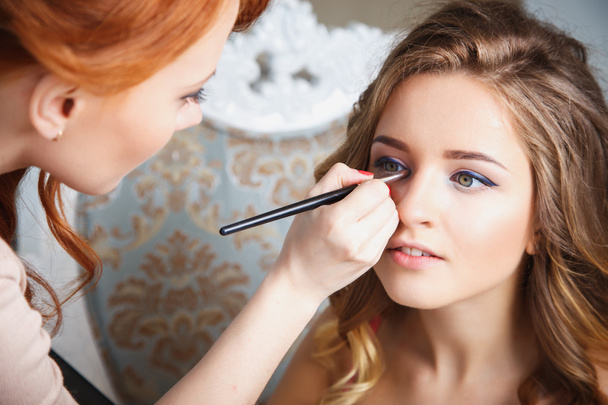 makeup artist preparing bride before the wedding in a morning - Photo, Image