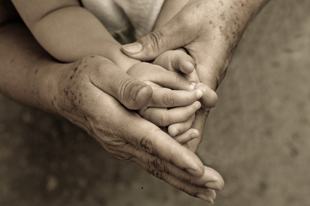 old hands holding young hand - Photo, Image