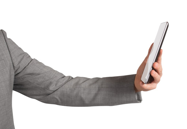 Geschäftsmann surft vom Handy aus im Internet - Foto, Bild