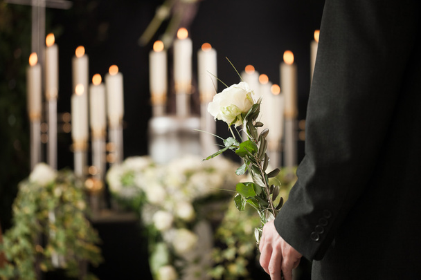 man at funeral with white rose - Photo, Image