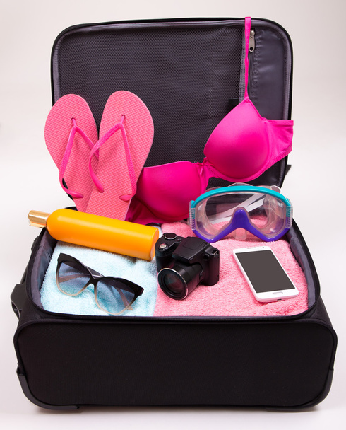 preparation for trip concept - open suitcase full of travel item - Φωτογραφία, εικόνα