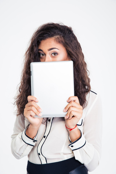 Businesswoman covering her face with tablet computer - Foto, immagini