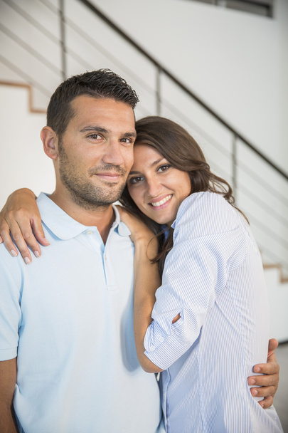 Smiling young couple in new home - Фото, изображение