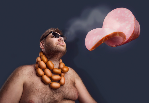 Fat man with sausages - Photo, Image