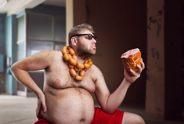 Fat Man met worst - Foto, afbeelding