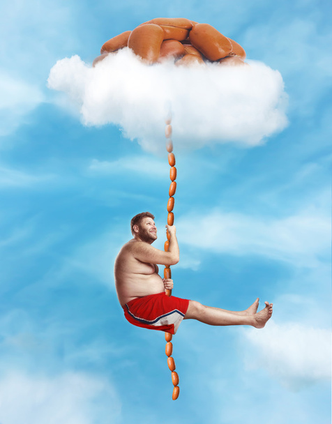 Gros homme accroché à la corde à saucisse
 - Photo, image