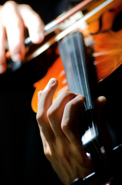 Violin player playing the intstrument - Foto, Bild