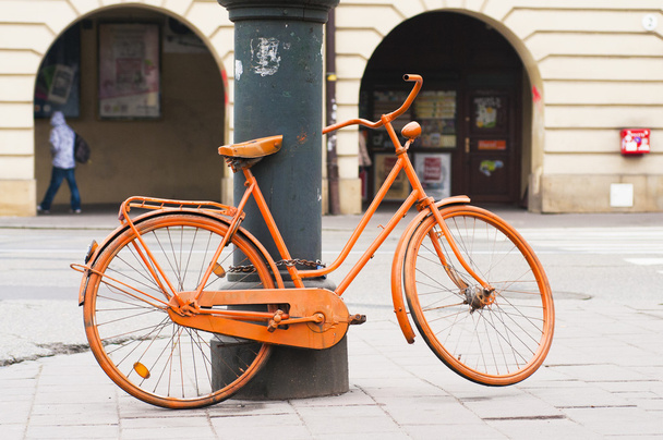 Orange bicycle on the street - Zdjęcie, obraz