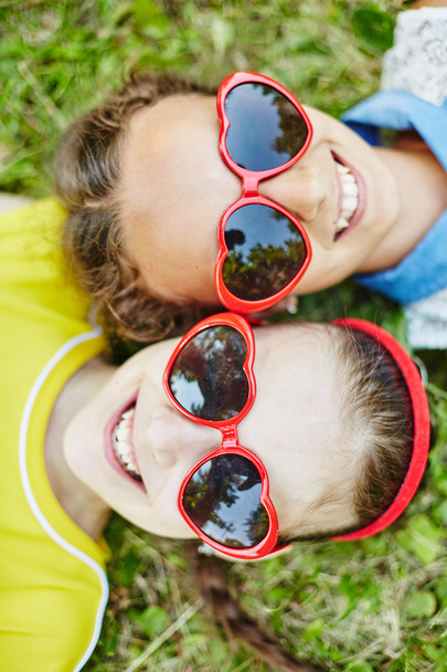 girls in heart shapes sunglasses - Foto, Imagem