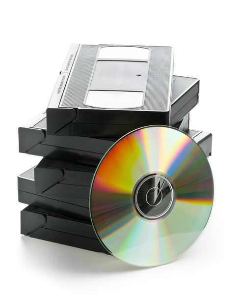 Stack of analog video cassettes with DVD disc - Фото, зображення