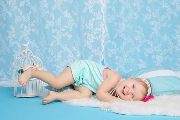 girl lying on floor studio portrait - Valokuva, kuva