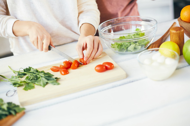 Hands of female cutting ingredients - Foto, immagini