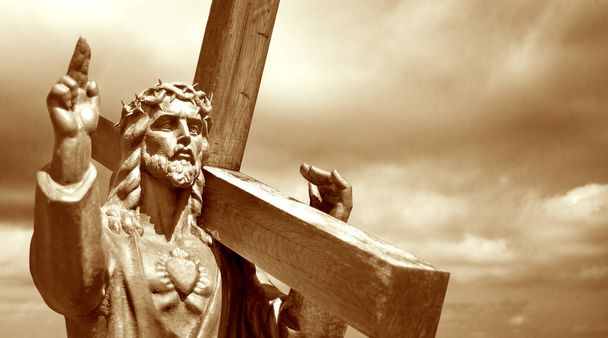 Jesus segurando uma cruz
 - Foto, Imagem