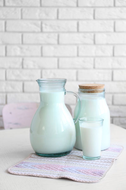 Pitcher, jar and glass of milk - 写真・画像