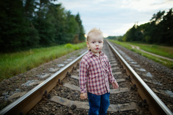 boy playing on the railroad - Foto, imagen