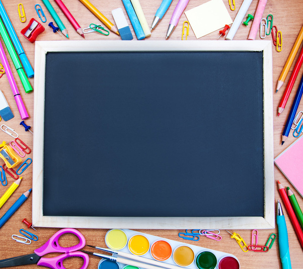 school supplies and blackboard - Foto, Imagen